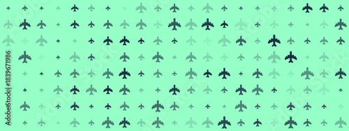 Seamless pattern of pixelated airplane icons in varying shades of green on a light background, representing travel and aviation