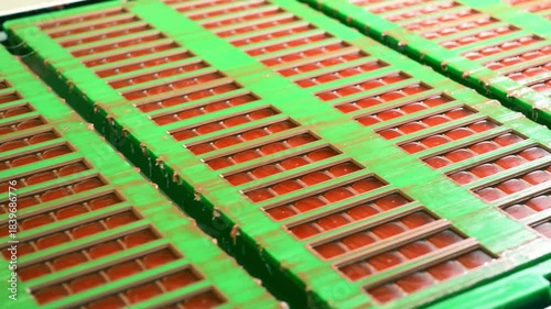 Chocolate bar production line with icing and liquid filling moving on conveyor belt in confectionery factory.