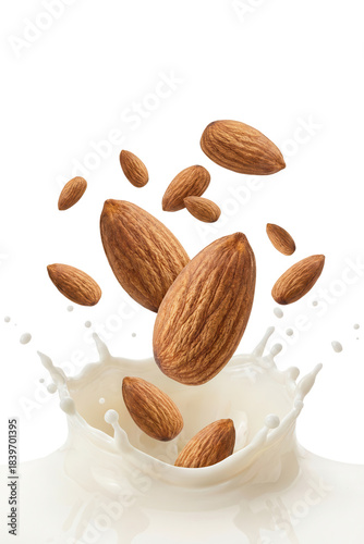 Almonds splashing into milk creating dynamic motion and freshness in a clean background