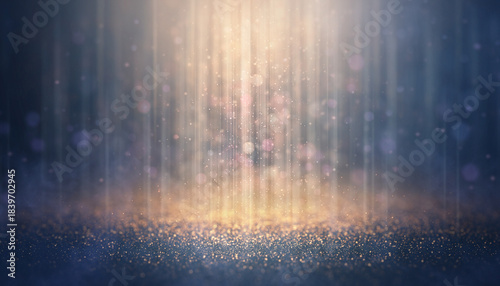 Golden vertical light beam illuminating shimmering dust particles on a dark surface.