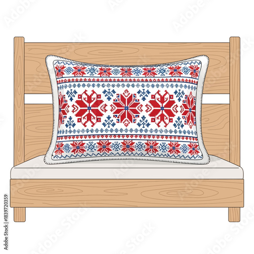 Decorative embroidered pillow with festive snowflake patterns on a wooden bed frame