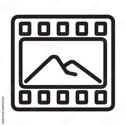 Film strip with mountain landscape inside frame