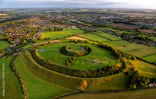 Old Sarum, Salisbury, dates from 3000 BC Neolithic. Shows Iron Age hillfort, Norman central motte and bailey and cathedral ruin. Salisbury city behind