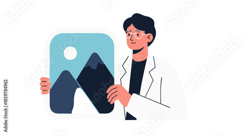 Man in White Lab Coat Holds Framed Mountain Landscape Artwork Indoors Wearing Glasses with Dark Hair and Dark Top with White Coat and Pink Sleeves on White Background