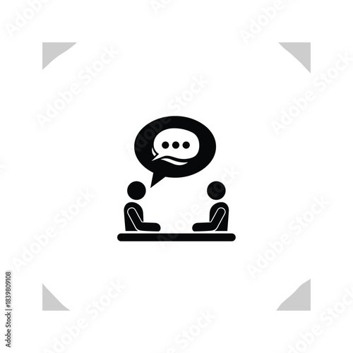 Two people sitting opposite each other at table with speech bubble above them black icon conversation symbol