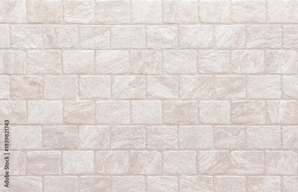 Naklejka premium Detail of modern cream brick wall background photo. White light brick wall texture background for stone tile block painted in beige light color wallpaper modern interior and exterior backdrop design.