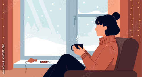 Woman enjoying warm drink by snowy window