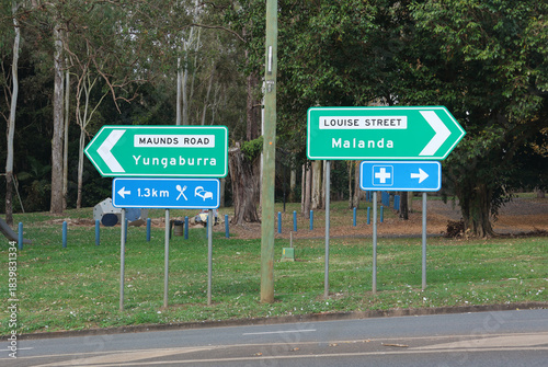 Directional signs pointing towards Yungaburra, Malanda, food, accommodation and the hospital in Atherton, Queensland, Australia