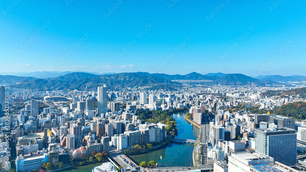 Naklejka premium Aerial view of modern cityscape taken by drone