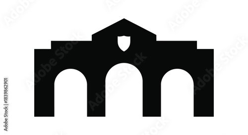 A striking black silhouette of an arched building facade with a shield emblem silhouette