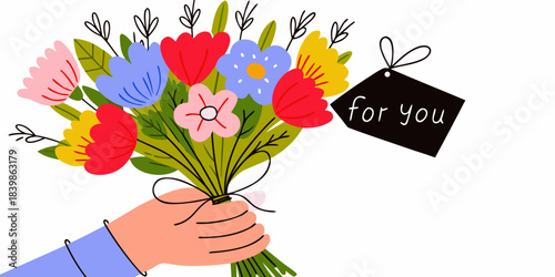 A colorful bouquet of flowers being offered with a for you tag