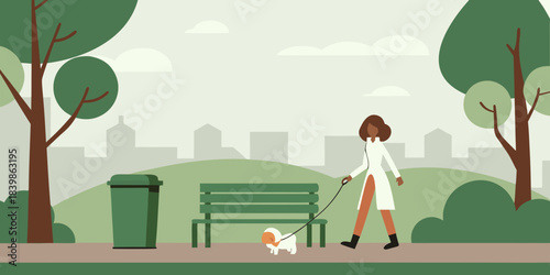 A woman walking her small dog in a serene green urban park setting