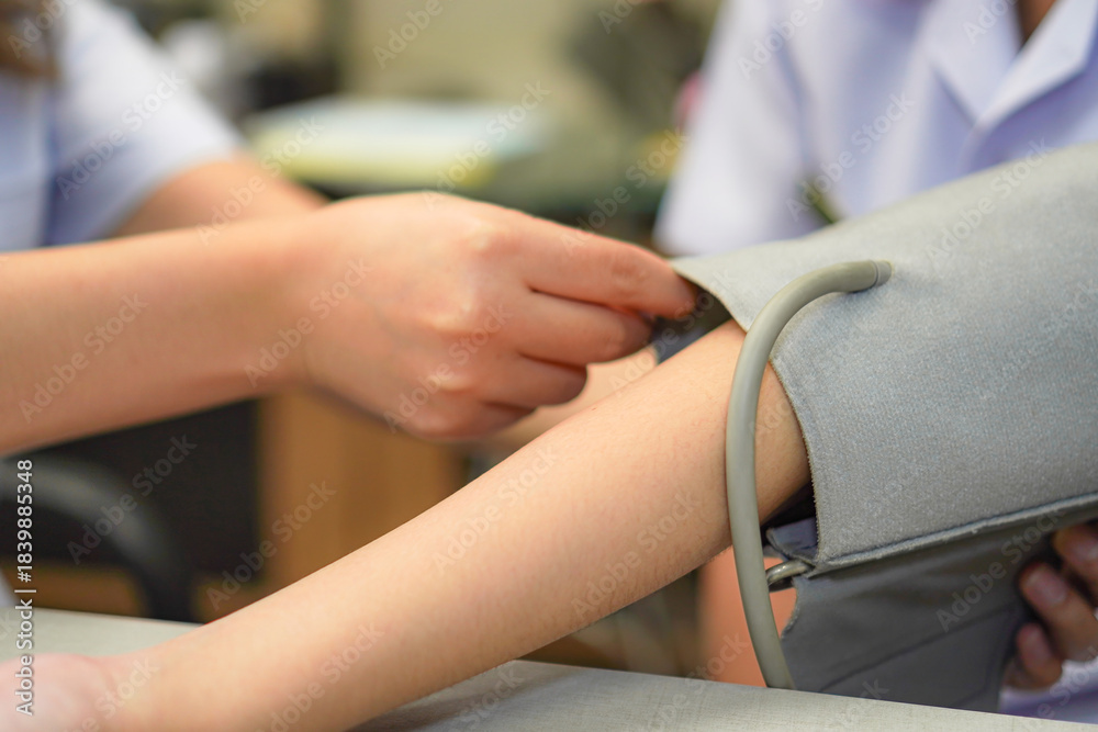 Fototapeta premium Pharmacist Demonstrating Proper Blood Pressure Cuff Positioning