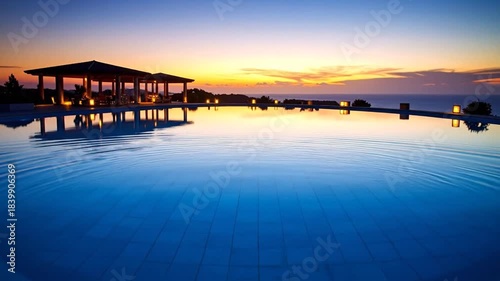 Tranquil Pool Sunset with Ripples, Gazebo, and Ocean View.
