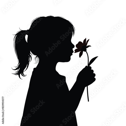 Silhouette of a Young Child Smelling a Flower. Childhood Joy, Nature, Innocence, and Simple Beauty Concept.