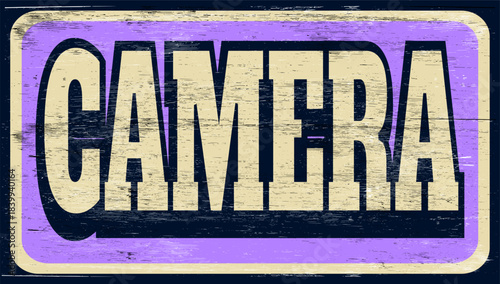Aged vintage camera sign on wood
