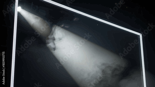 Spotlight illuminating smoke within a geometric frame creating a dramatic and atmospheric effect for stage or event design