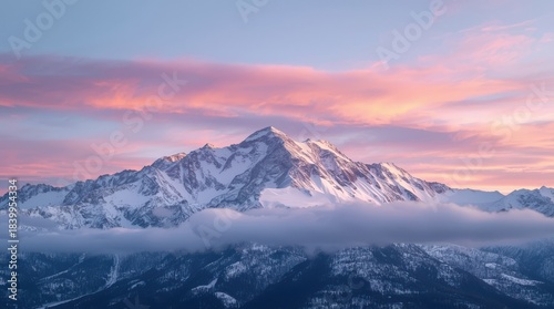 Snowy mountain peaks with low-lying clouds and soft pink sunset hues in the sky Generative AI