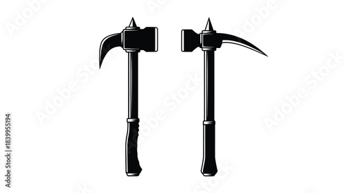Two vintage black hand axes with curved blades side by side display