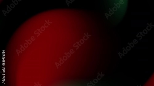 Blurred red and green lights on a dark backdrop. Suitable for abstract backgrounds, holiday designs, festive concepts, and creative projects.