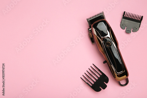 Hair clipper on pink background. Modern hair clipper.