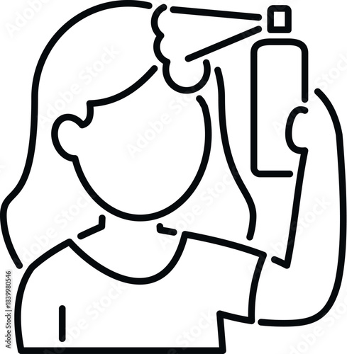 Woman applying hair product to her hair with an aerosol can