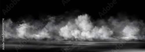 Water surface with smoke and fog effect at night - mysterious glowing mist rising over dark ground. Black background with white cloud haze and spooky atmosphere for horror or mystery design.