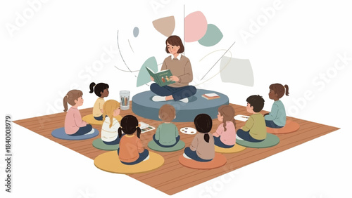 A woman sits cross-legged on a cushion, reading a book to a group of diverse children sitting on colorful mats in a circle on a wooden floor.
