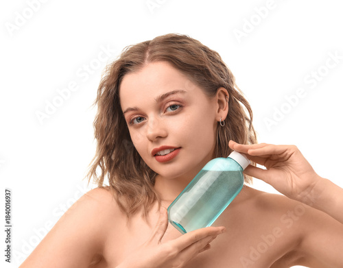 Young woman with bottle of ...