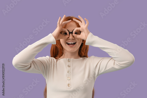 Teenage redhead girl showin...