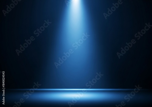 A bright blue spotlight illuminates a dark stage background for a dramatic effect