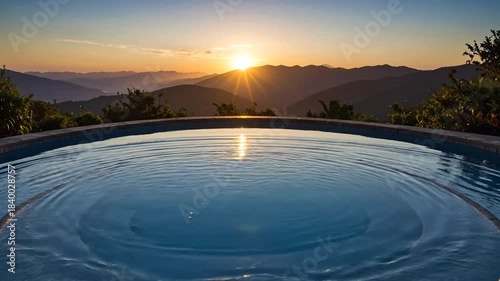 Sunset over Mountain Pool with Ripples and Golden Light