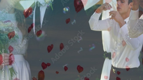 Bridal couple and attendant standing in flat design wedding with bouquet, rose petals, soap bubbles