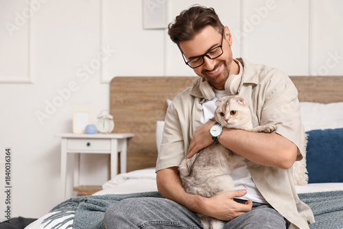 Young man with cute Scottis...
