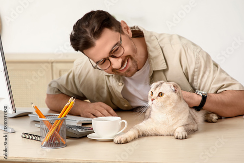 Young man with cute Scottis...