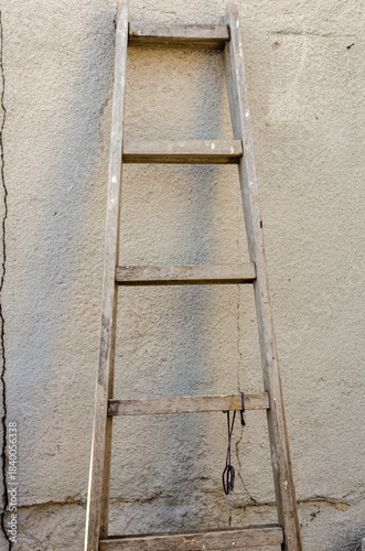 Old ladder leaning against the wall