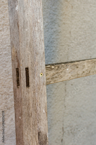 Old ladder leaning against the wall