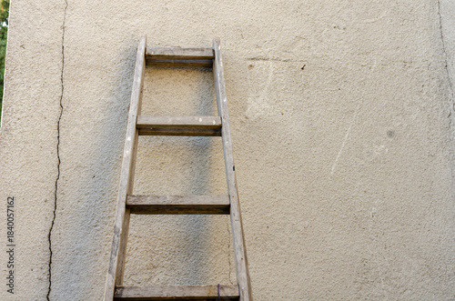 Old ladder leaning against the wall