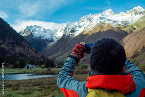 hiking photographer in the mountains around Lake Estaing, France
