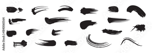Collection of abstract black brush strokes ink splatters and grunge lines on white background
