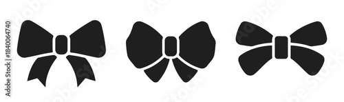 Three Black Silhouettes of Bows Keywords: bow, ribbon, knot, decoration, gift, present, icon, symbol, graphic, design, illustration, set, collection, fashion, accessory, hair accessory, tie