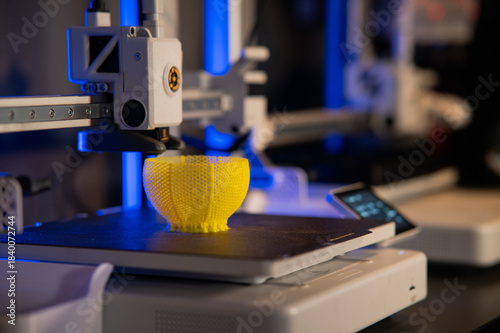 A student man print prototype on 3D printer