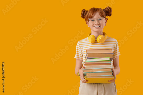 Cute redhead girl with stac...