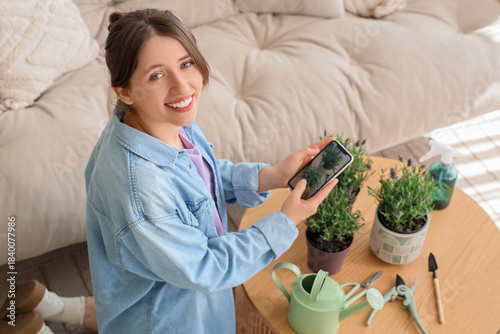 Young woman taking picture ...