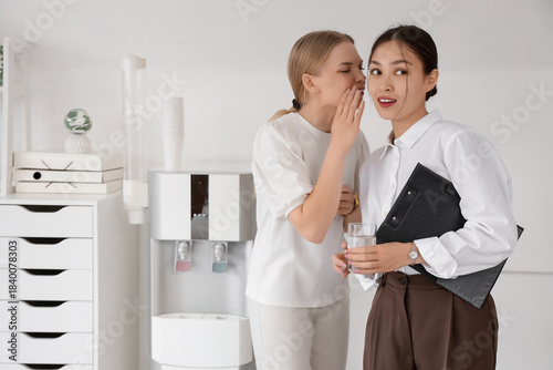 Young business women gossip...