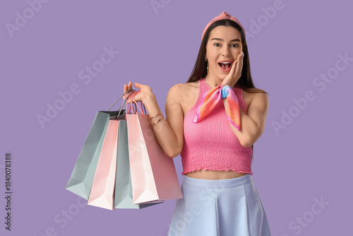Happy young woman with shop...