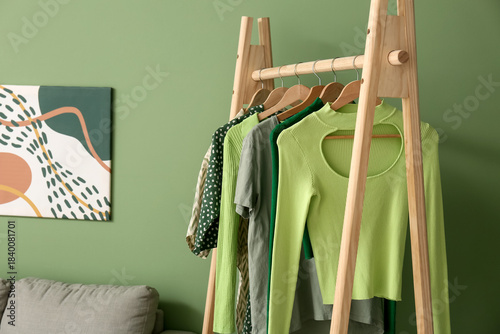 Rack with stylish clothes n...