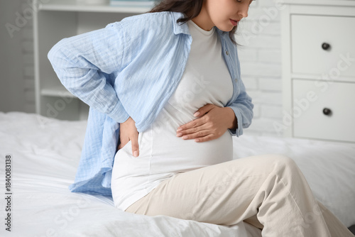 Young pregnant woman suffer...