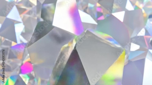Abstract close-up of geometric shapes, iridescent colors, and refracted light