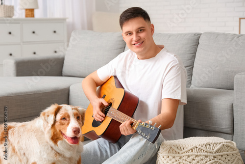 Young man with guitar and c...